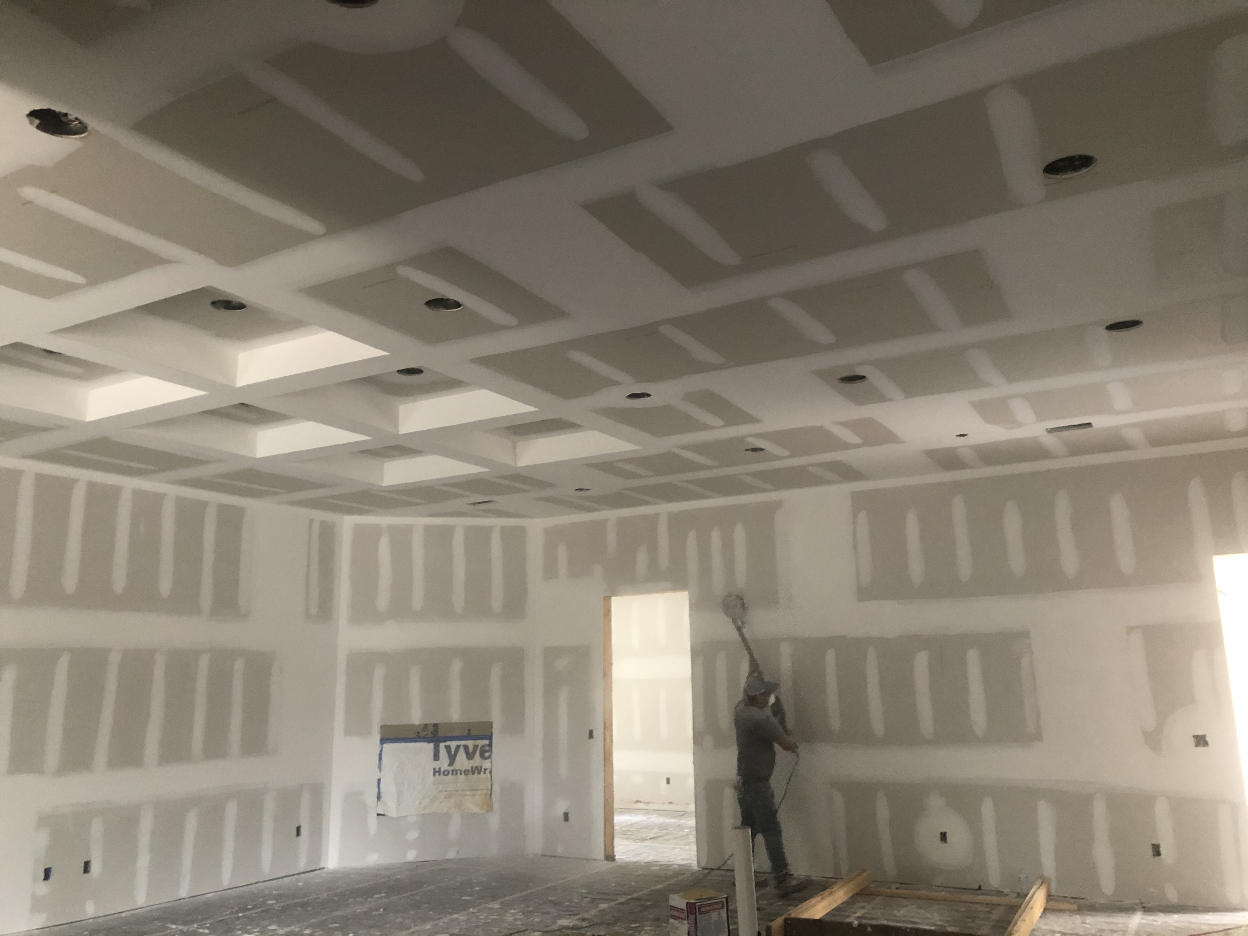 Finishing drywall in Cantonment Mack Custom Homes
